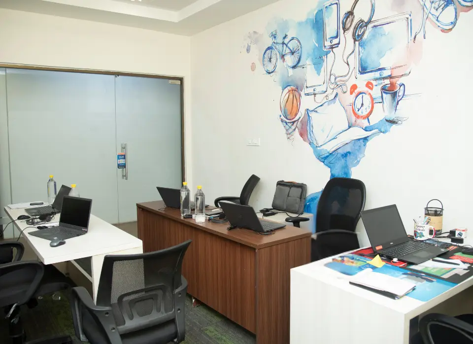 A vibrant coworking space at Fun@Work’s Bhubaneswar locations (Saheed Nagar & Hanspal Square) with modern workstations, 1 Gbps Wi-Fi, and professionals collaborating.